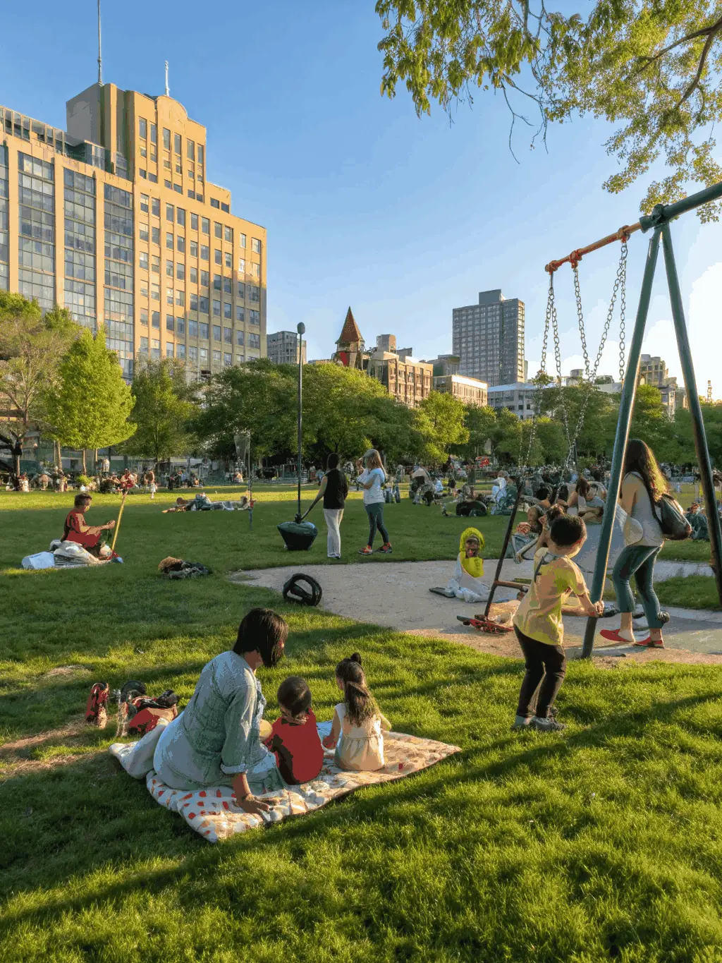A photograph capturing a lively scene from a community festival organized by COMITE DES FETES ET LOISIRS, with families, children, and volunteers enjoying outdoor activities in a vibrant setting.
